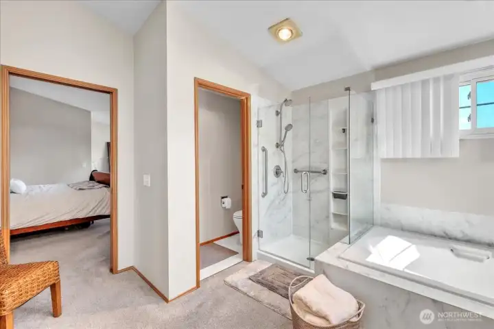 The primary bath offers a soaking tub, walk-in shower, dual vanity, private toilet, and a spacious walk-in closet.”