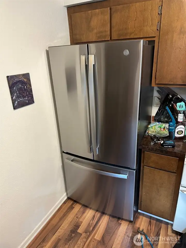 Unit B kitchen. Newer stainless side by side fridge