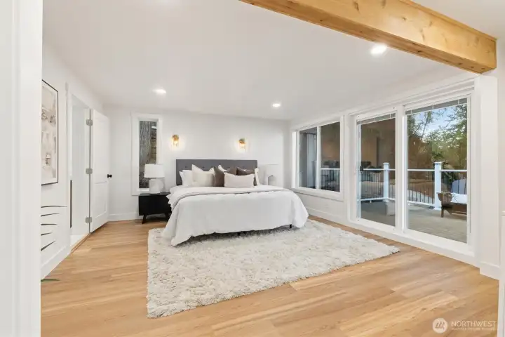 Primary suite features an ensuite bathroom and a private balcony