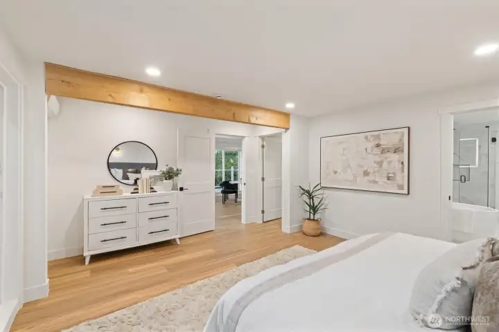 Primary suite features an ensuite bathroom on the main level