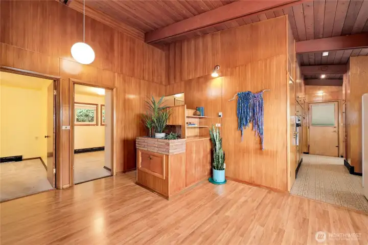 View from the front entrance. Note the built in communication center ;) and brick built in plant container.To the right is the kitchen. To the left are entrances to 2 of the 3 bedrooms on the main floor.