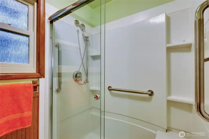 Bathroom has walk in shower.
