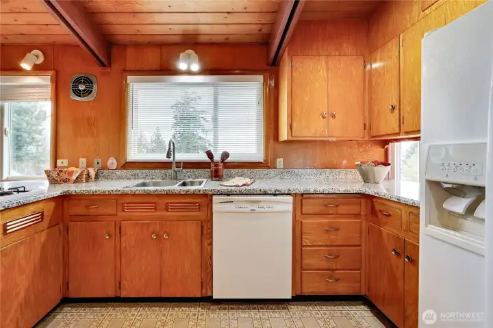 Large kitchen with granit top counters.