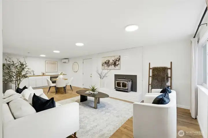 Spacious lower-level living area with fireplace, perfect for a bonus room or potential MIL suite in this Kent home.