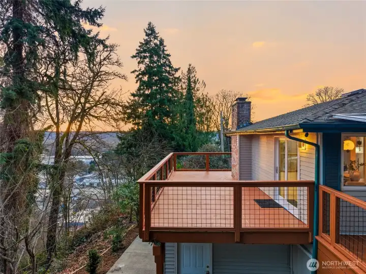 Expansive upper deck with wooded territorial views, ideal for entertaining at this Kent WA home for sale.