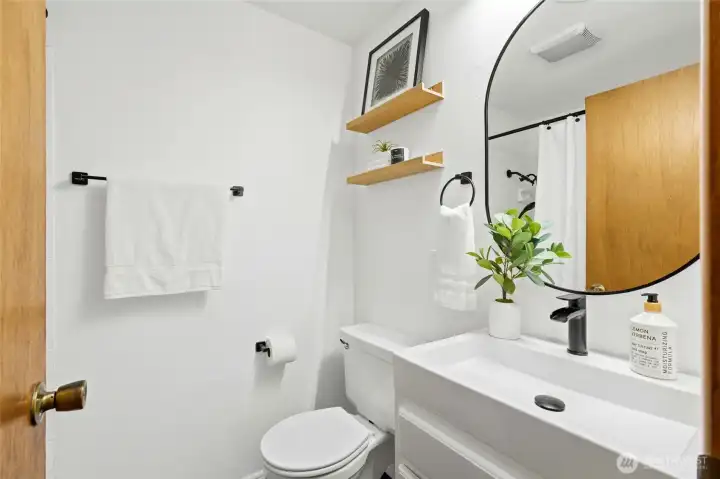 Additional bathroom with clean finishes and functional layout.