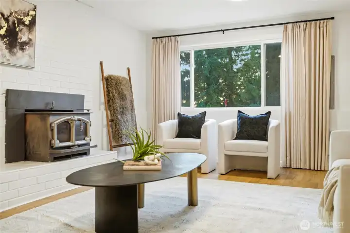 Cozy lower-level living area with natural light and comfortable seating space.