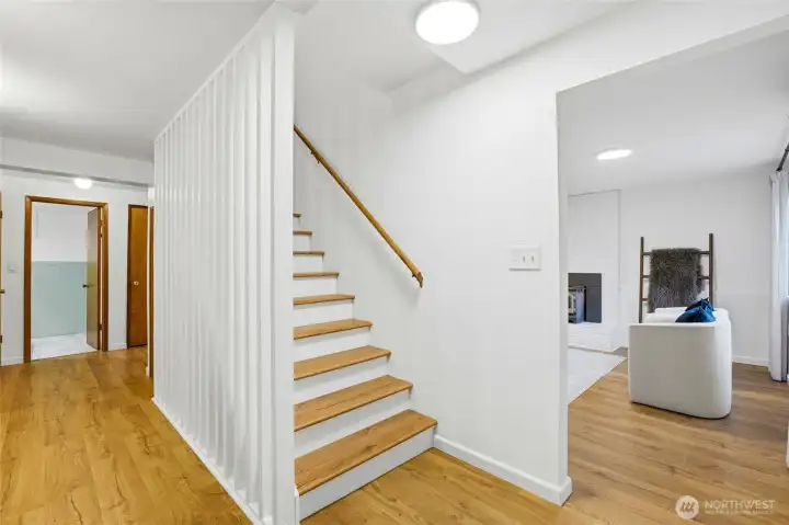 Interior entry and staircase leading to lower-level living space with potential MIL setup.