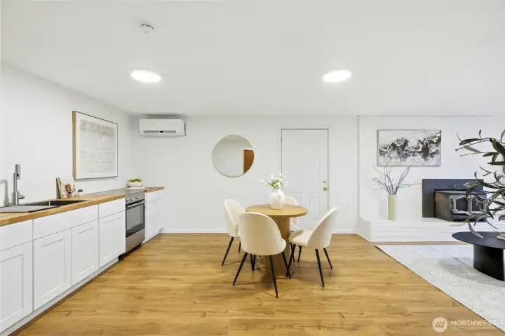 Additional lower-level dining or living area with open layout and modern updates.