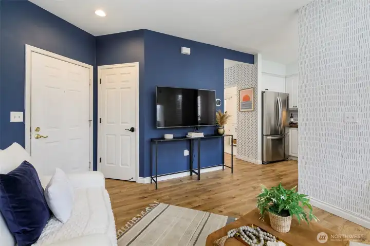 Large coat closet offers extra storage as a mud-space.