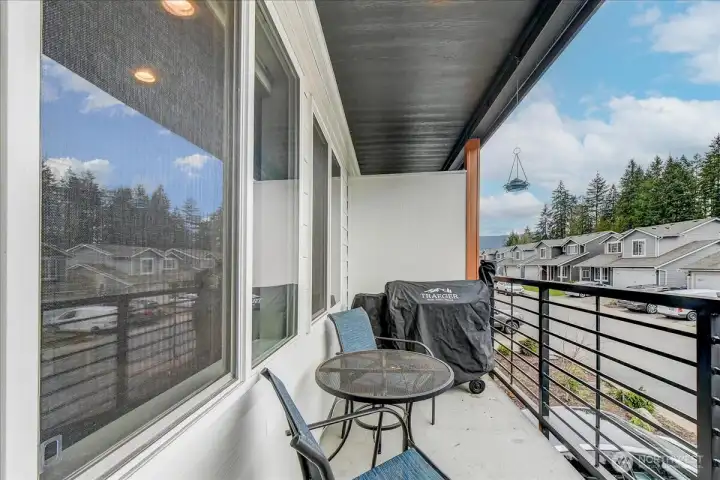 Balcony is off the Great room.  There is a duplicate of this deck above, just off the Primary suite.