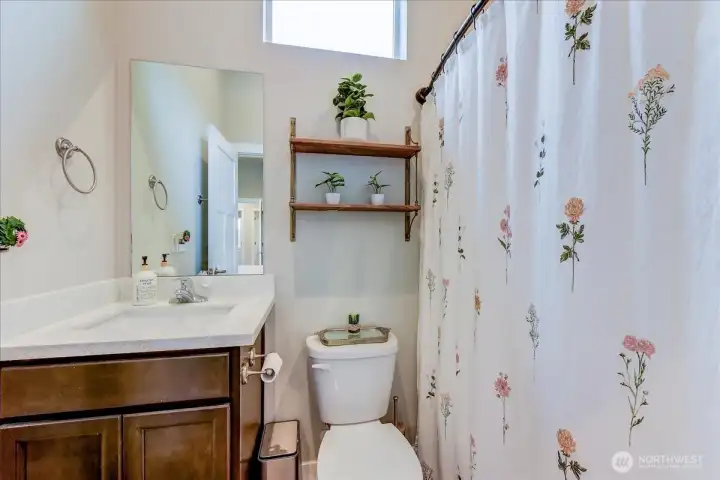 Primary full bath with natural light.
