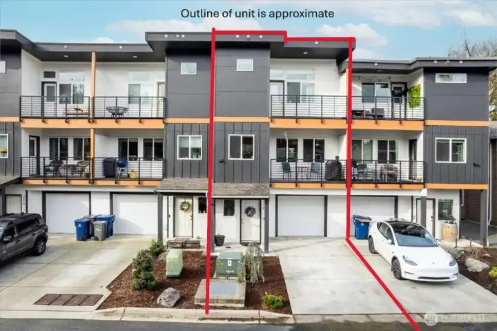 Approximate lines drawn around the townhome and driveway.