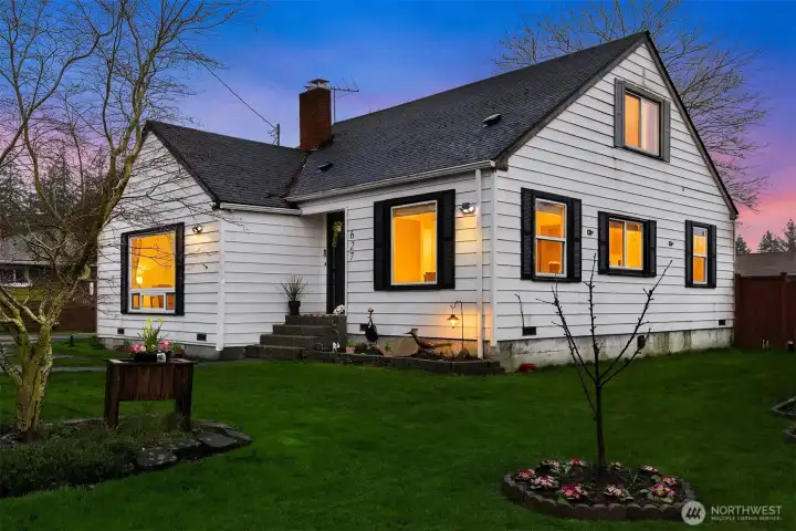 Exterior of the home by twilight.