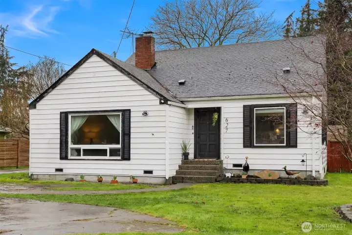 This home is set far back from the road with an ample front yard and parking spaces.