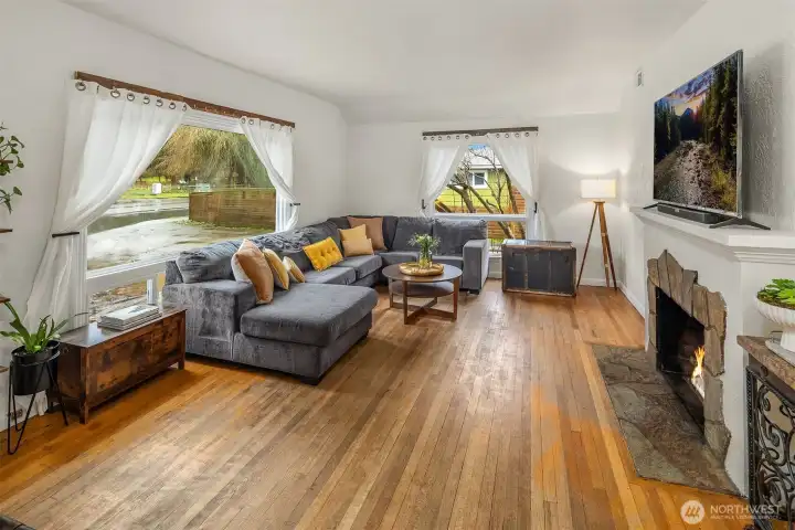 Flowing original hardwoods can be refinished and restored to their natural beauty.