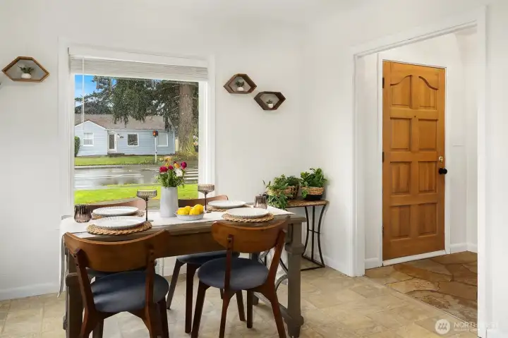 Vinyl flooring needs to be ripped out and replaced in this kitchen and dining area.