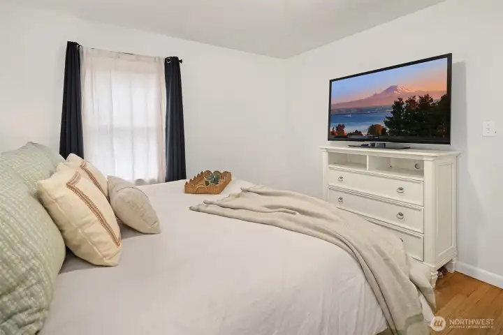 This primary bedroom fits a king size bed.