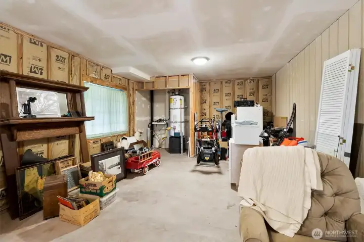 Entering Garage Shop space. Water heater is being replaced with