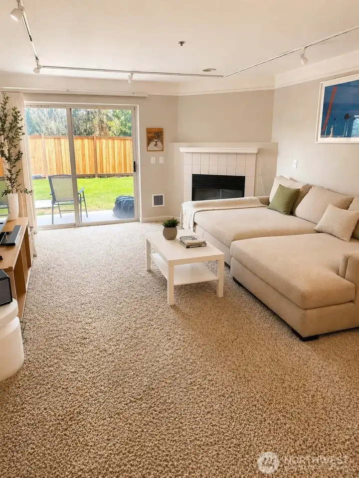 Second view of the living room.  Photo has been enhanced to better showcase the space.