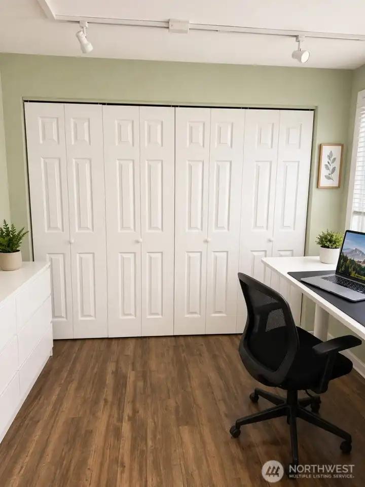 2nd bedroom with large closet.  Photo has been enhanced to better showcase the space.