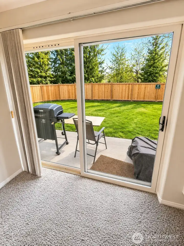 Unit has a patio looking out onto common yard.  Photo has been enhanced to better showcase the space.