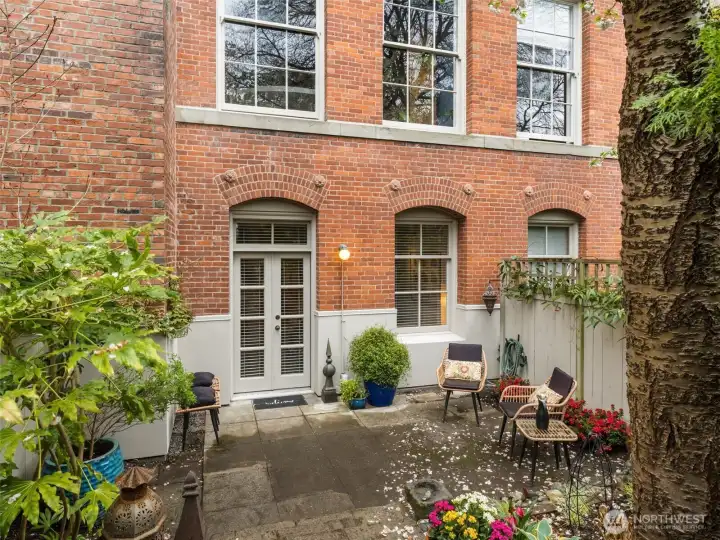 Your own private patio- a wonderful outdoor room to welcome your guest, relax, or get your gardening fix.