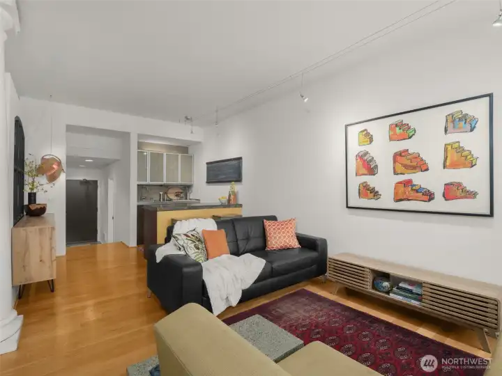 Beyond the living room is the centrally located kitchen. The door at the back is your main entrance- you'll use this when you come home via the secure garage.