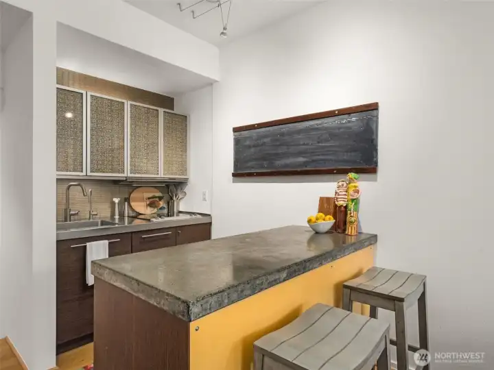 Small, but mighty...you'll be amazed at the efficiency of this well designed kitchen! Slate chalkboard was retained from the building's schoolhouse days.