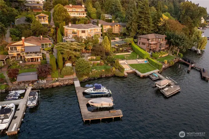 Estate Scale: A masterfully designed 6,092 sq. ft. residence situated on a significant 0.41-acre lot offering rare island privacy. 6 bedrooms, 7 baths with media room, office, reading room. 90 ft of waterfront, dock with two slips, sauna, hot tub, this home has it all!