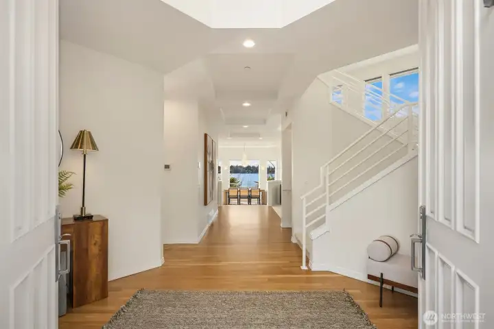 As you enter, gorgeous lake views greet you. A fresh Canvas: The entire interior has been refreshed with brand new designer paint, and beautifully refinished flooring throughout, and brand-new carpets.