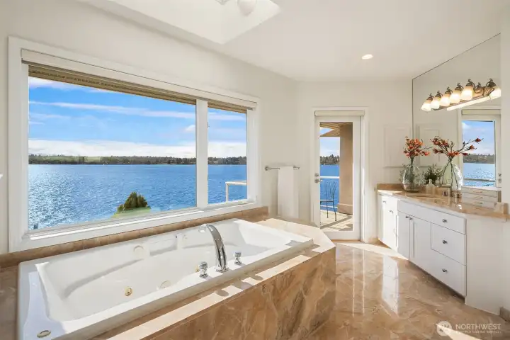 Start your day with panoramic lake views framed by oversized windows that flood the sanctuary with natural light.