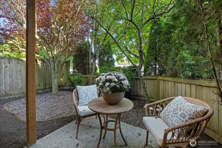 A hard-to-find, fully fenced yard offers space for gardening (including an apple tree), play, or a safe place for Fido.