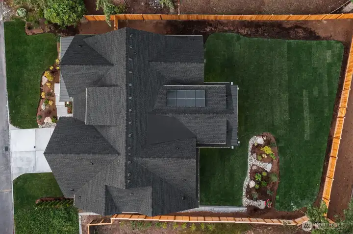 This home contains solar panels. The photo shown above is from a different MN Custom Home with a simiar solar array