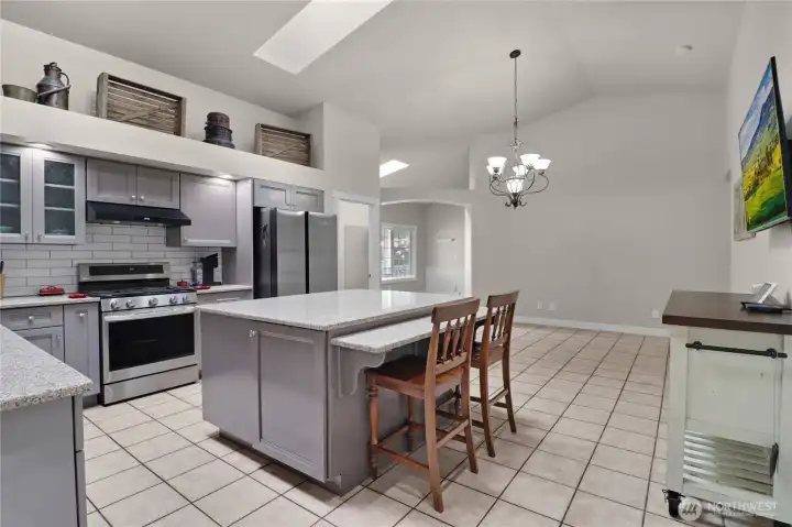 Stainless steel appliances and granite countertops finish out this perfectly appointed kitchen.