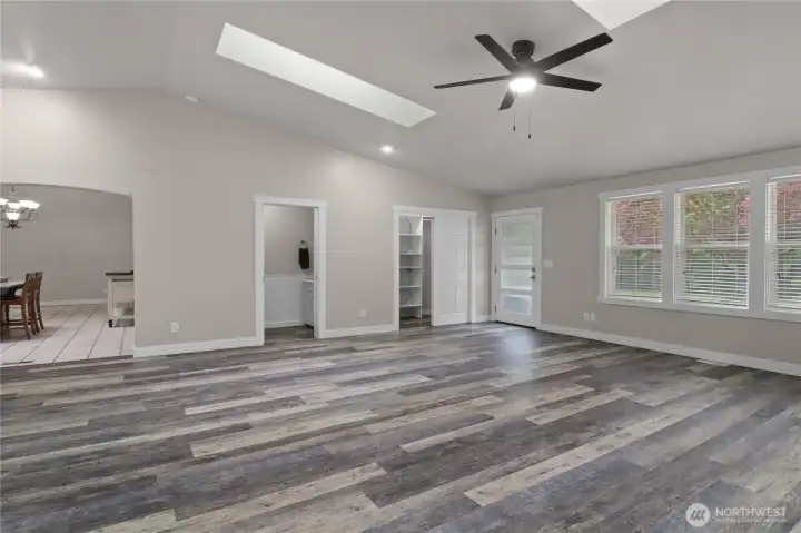 Large arched entry to kitchen makes for great flow.  The 1/2 bath is perfectly placed and the beautiful entry door leads to the expansive deck and back yard.