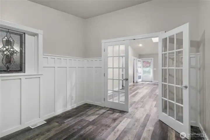 The french doors, relight window, and trim work give this den/office a touch of elegance.
