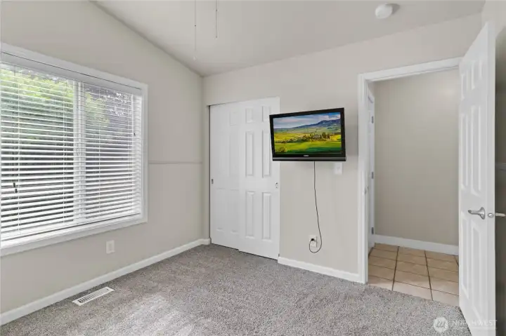 3rd bedroom with large window to backyard.