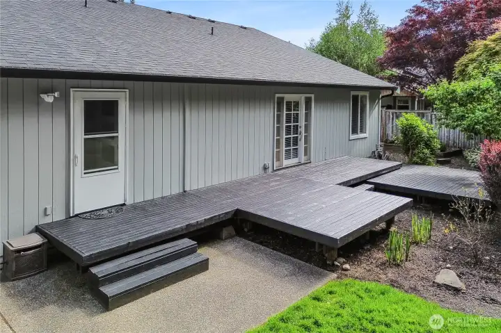 Large, well maintained deck is perfect for enjoying the beautiful back yard.