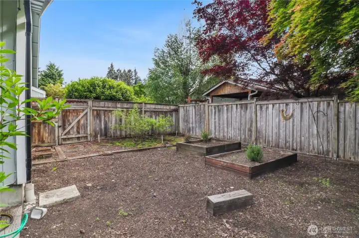 The side yard offers this gardening space to enjoy.