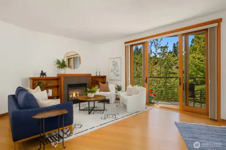 Floor-to-ceiling windows and sliders open to garden view baclony. Floor-to-ceiling windows and sliders open to garden view baclony.
