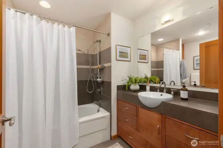The luxurious primary bath with soaking tub and custom vanity. The luxurious primary bath with soaking tub and custom vanity.