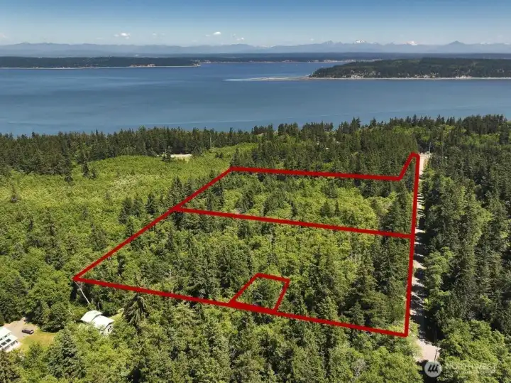 The front of the photo shows the two parcels. Behind it is the Lodge and cabin property referenced in the listing. The front of the photo shows the two parcels. Behind it is the Lodge and cabin property referenced in the listing.