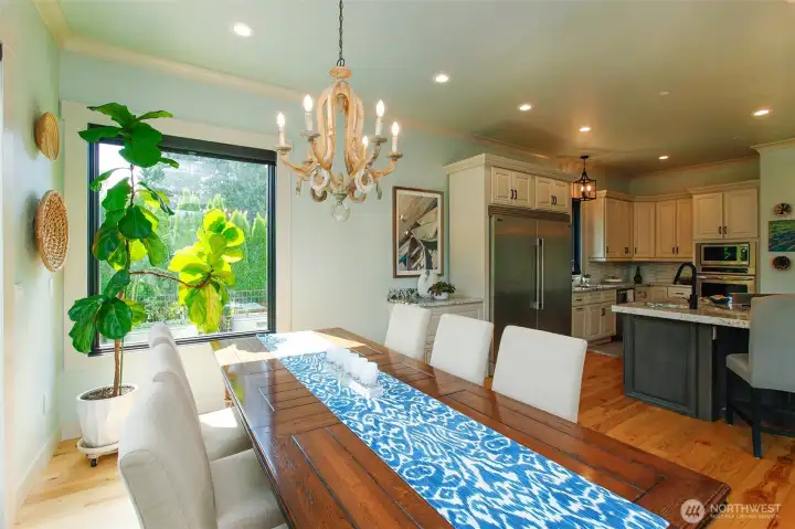 Dining room open to more seating at the kitchen island. Dining room open to more seating at the kitchen island.