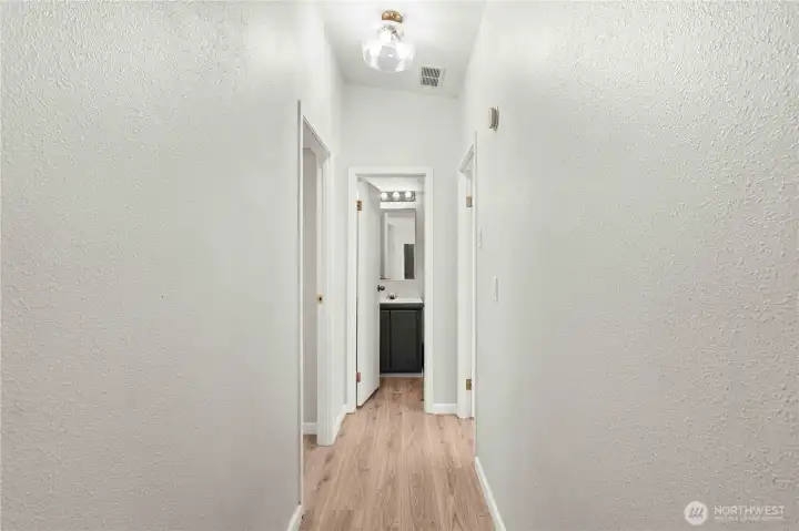 Hallway to 2 more bedrooms and bathroom