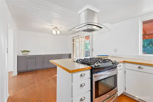 Open Kitchen and Dining Area with Side Counter and Generous Storage