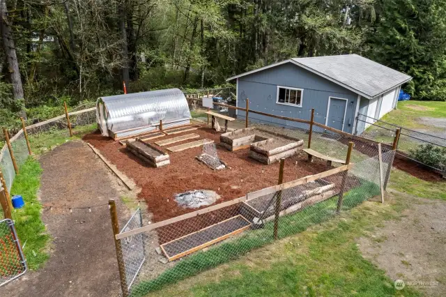 Large, fenced garden space with raised beds and greenhouse (there's power to the greenhouse, too!)