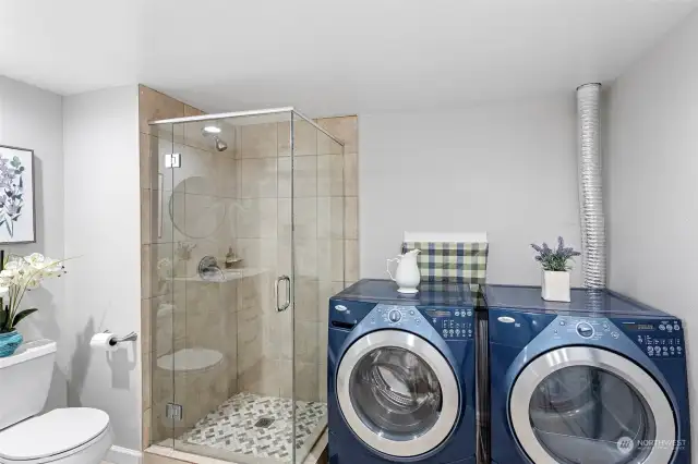 The spacious 3/4 bath and laundry room are on the lower level.