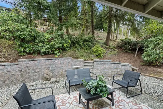 Enjoy serenity, refresh, and relax in the wooded backyard off the dining room.