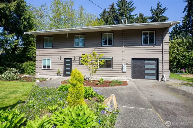 Plenty of parking on extra wide drive. Covered raised walkway leads to the entrance. Entrance features privacy glass and wired for technology.